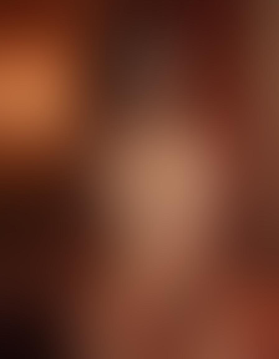 A captivating scene depicting an elegant and intimate boudoir setting, featuring a graceful erotic actress in mid-performance, with warm, sultry lighting casting soft shadows. Surround the actress with artistic elements like flowing fabrics, luxurious textures, and subtle hints of sensuality that evoke pleasure and artistry. Capture a sense of allure and empowerment, bringing the viewer into the world of erotic performance. super-realistic. warm colors. soft focus.